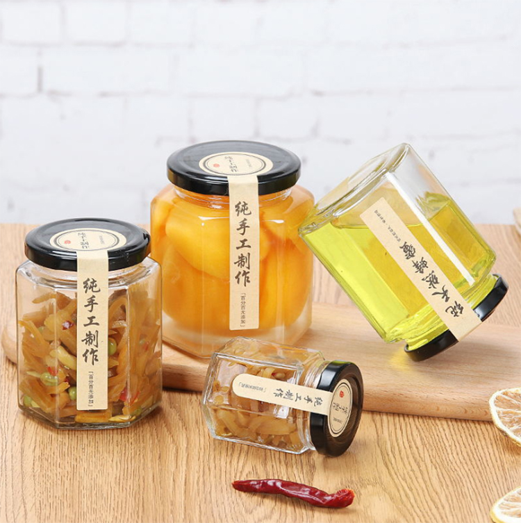hot selling whole 700ml 35oz glass bee shaped honey jar glass hexagonal jar for honey package with screw top lid