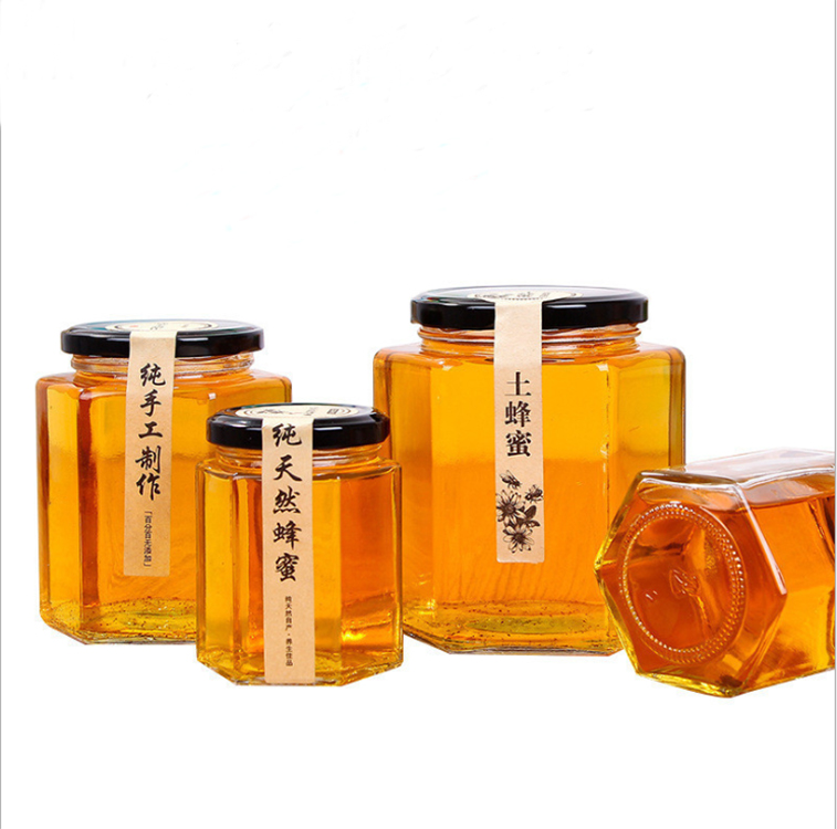 hot selling whole 700ml 35oz glass bee shaped honey jar glass hexagonal jar for honey package with screw top lid