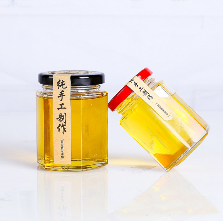 hot selling whole 700ml 35oz glass bee shaped honey jar glass hexagonal jar for honey package with screw top lid