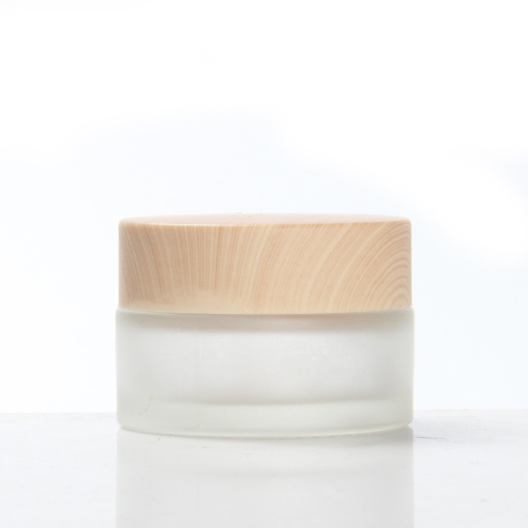 lightweight customized logo easy to use matte thickened Glass Cream Bottle Jar with wood grain cap 50g