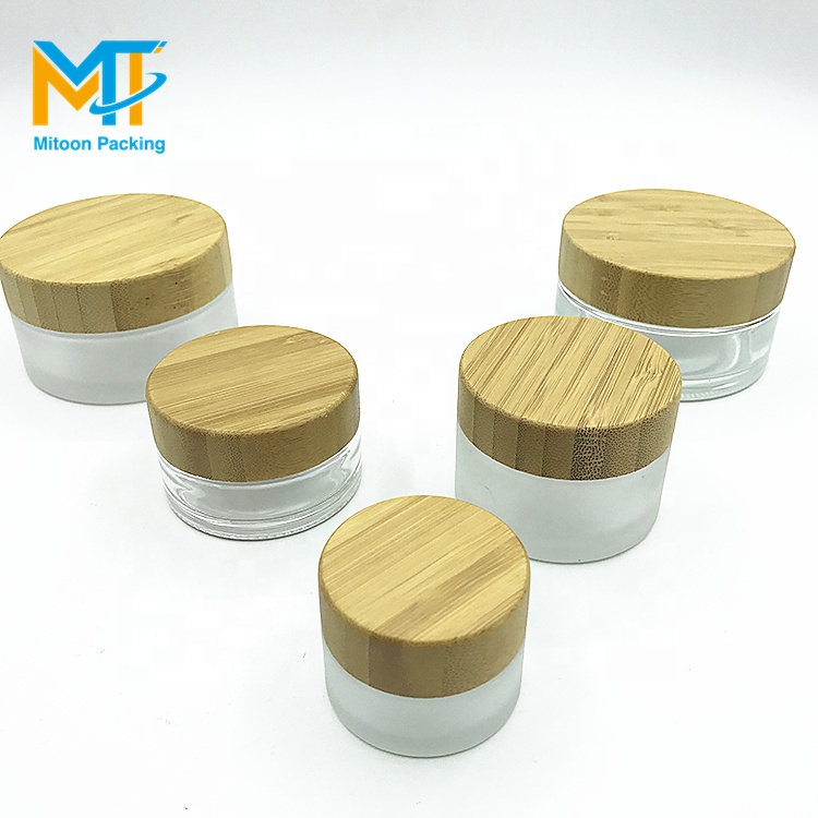 luxury 30g cosmetic frosted glass cream jar with bamboo wood cap