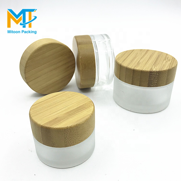 luxury 30g cosmetic frosted glass cream jar with bamboo wood cap