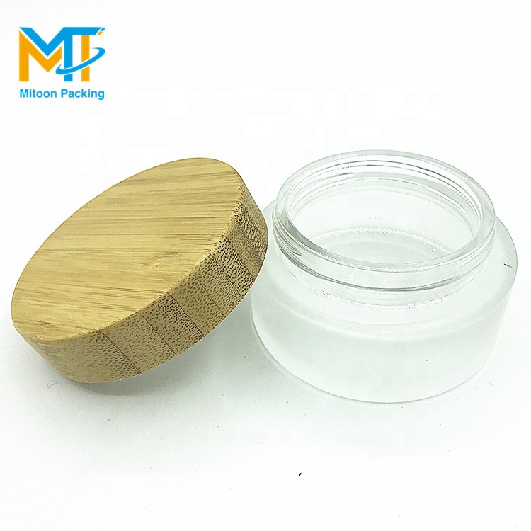 luxury 30g cosmetic frosted glass cream jar with bamboo wood cap