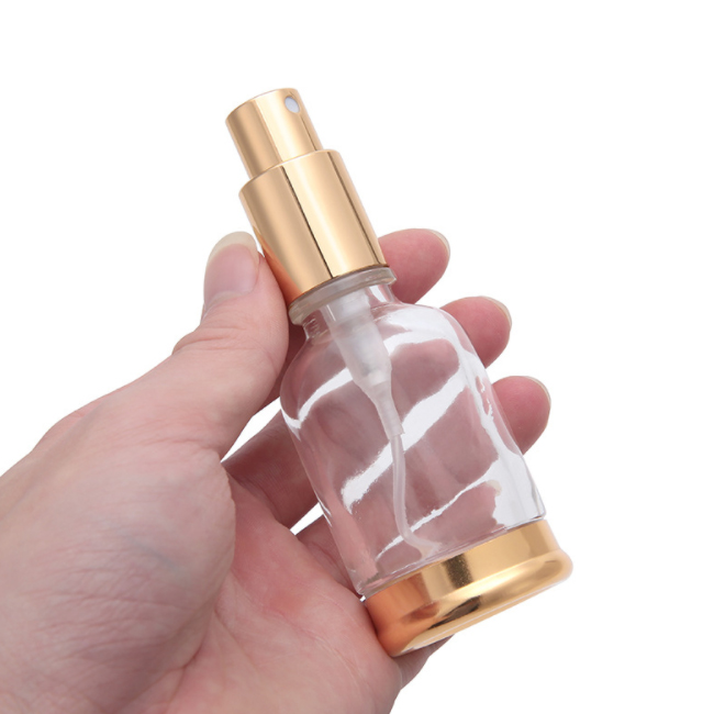 luxury 30ml clear glass round CBD cosmetic essential oil spray bottle perfume bottle container with gold mist sprayer lid bottom