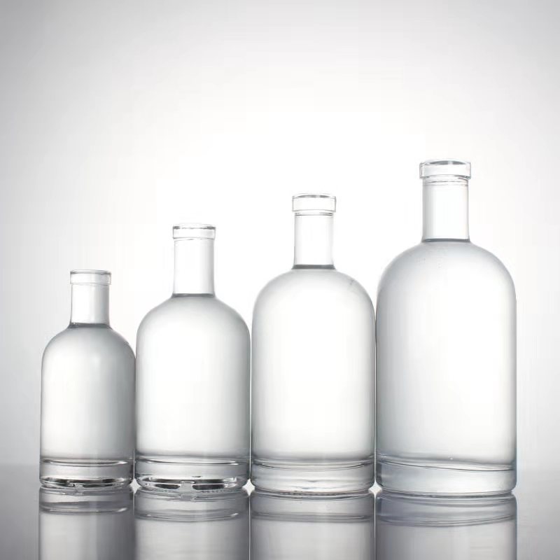 luxury 375 ml 500 ml 750 ml 1000 ml cork top screw GPI top cap round glass bottles for liquor whiskey vodka brandy spirits