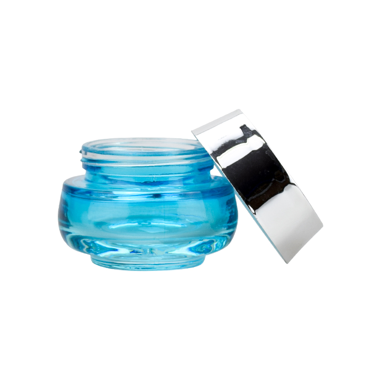 luxury cosmetic packaging 50g oval shape blue glass jar 50ml beauty packaging jars and bottles with shiny silver lid