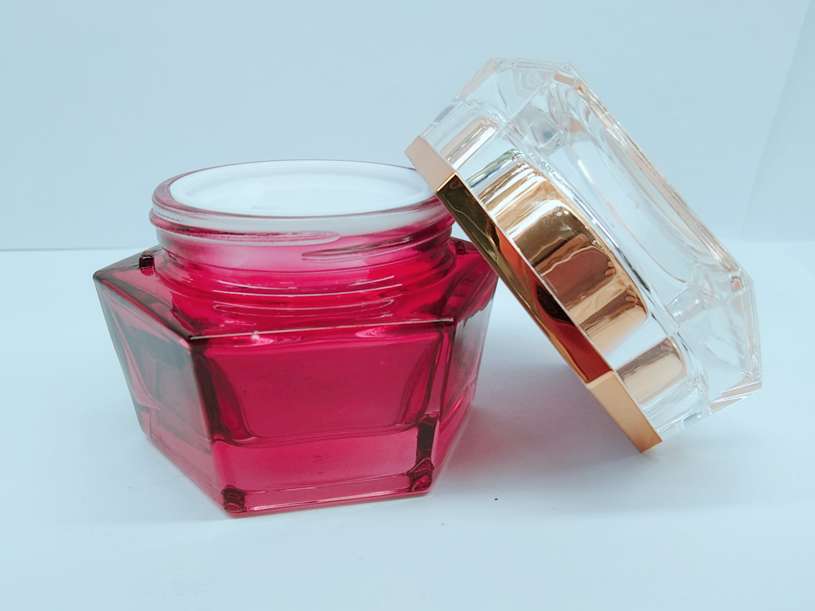 luxury hexagon shaped gradient red color emulsion glass bottle set