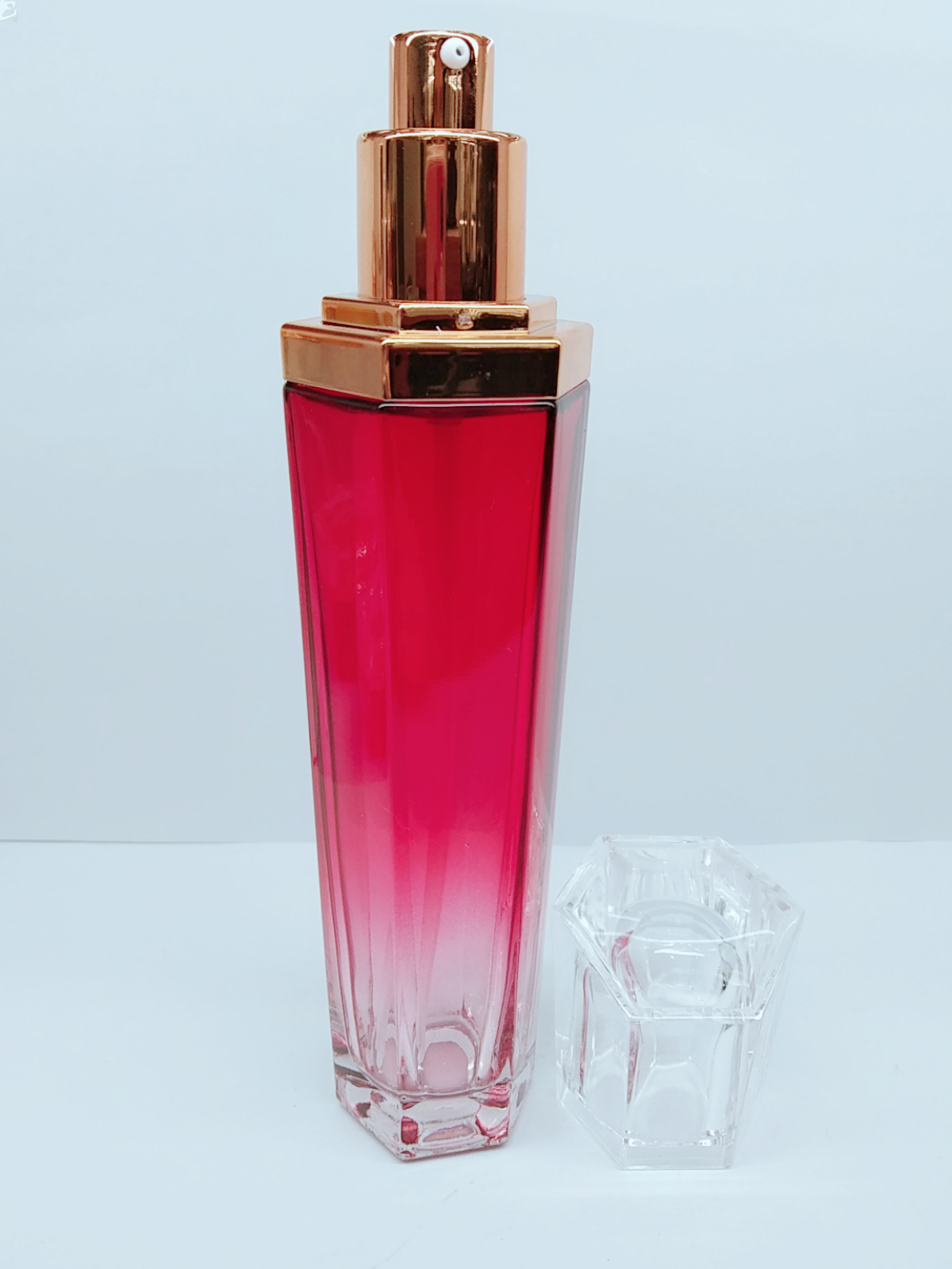 luxury hexagon shaped gradient red color emulsion glass bottle set