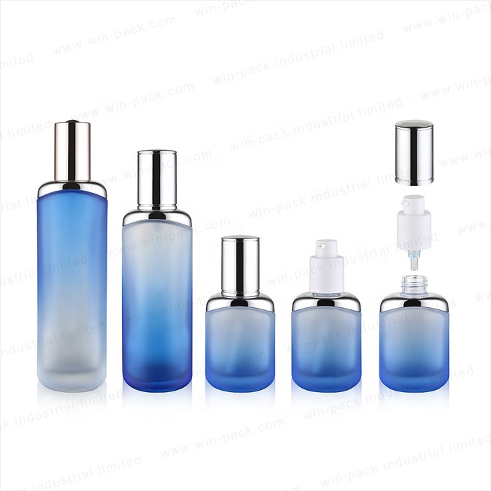 luxury round silver shoulder pretty transparent blue color 35ml 100ml 120ml unique glass lotion pump bottles for cosmetic