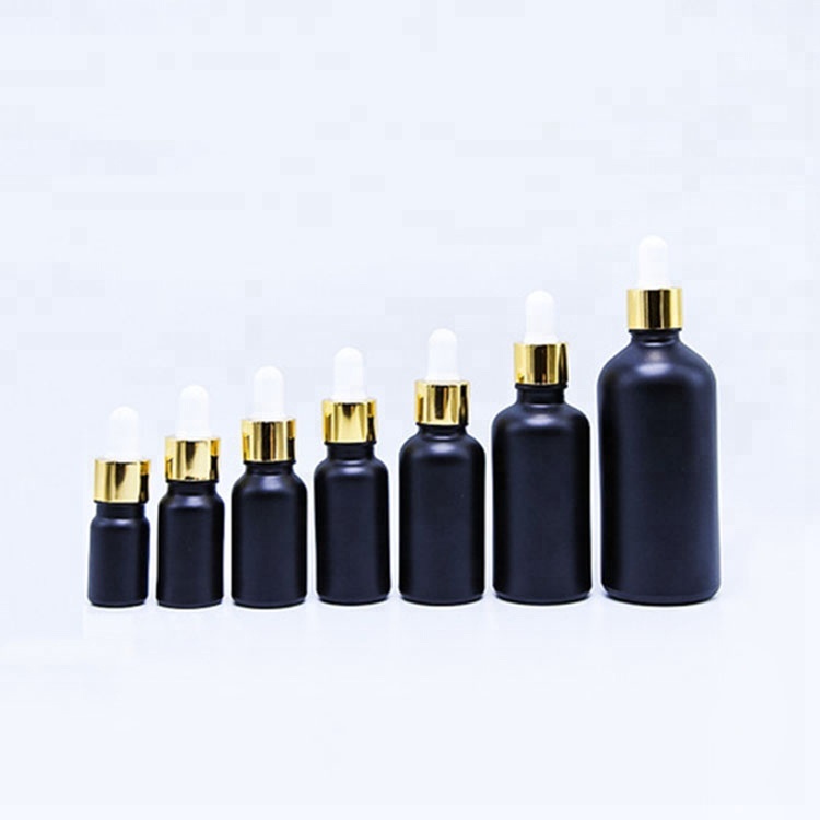 matt black essential cosmetic oil glass bottle 30ml with shiny gold aluminum dropper cap