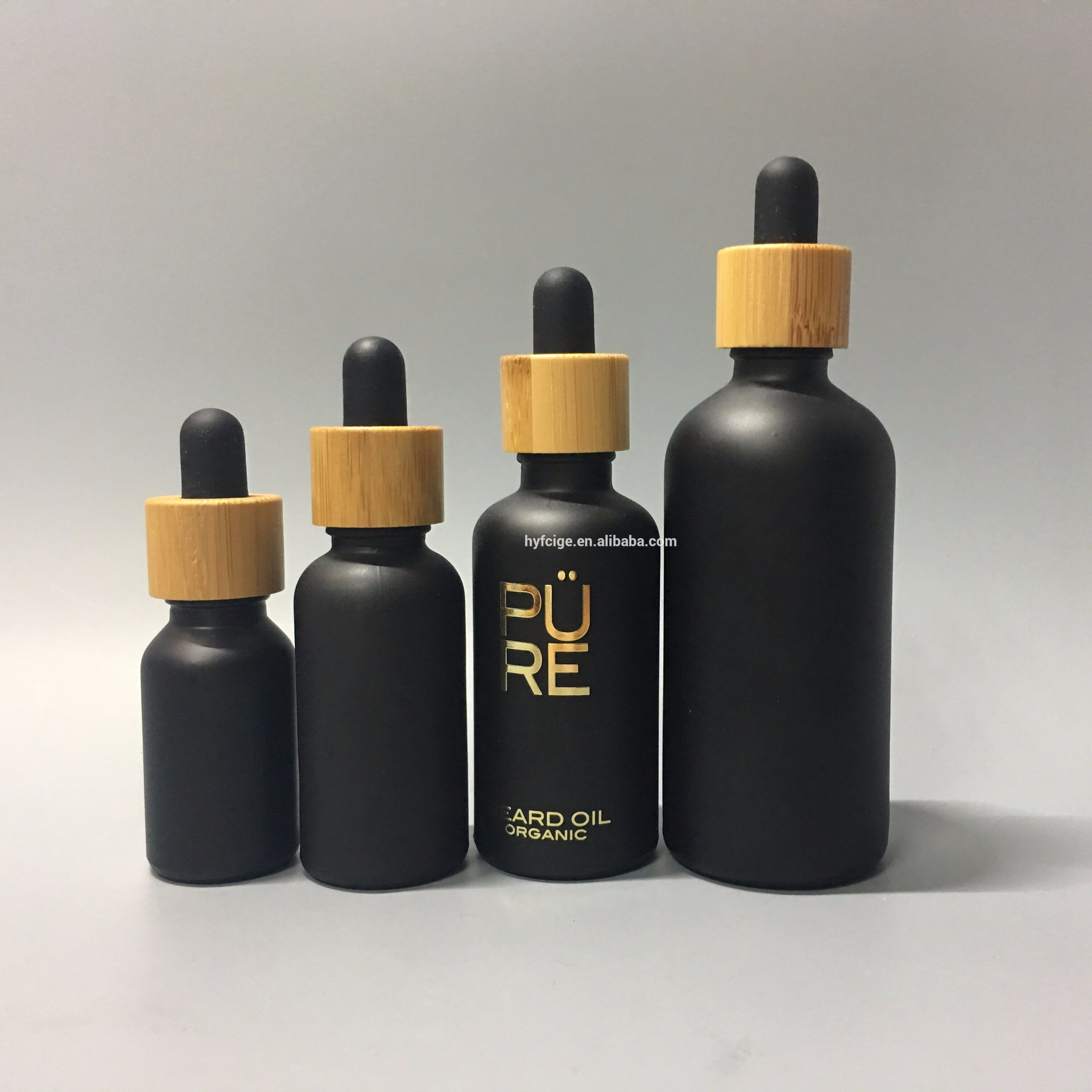 matte black glass bottle with bamboo cap and hot stamping