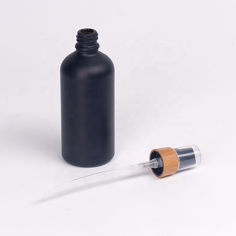 matte black glass bottles 15 ml 30 ml 50 ml 100 ml UV glass essential oil bottles with 18 mm bamboo wooden treatment pump