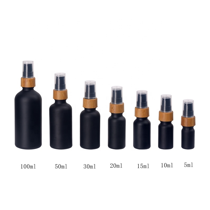 matte black glass bottles 15 ml 30 ml 50 ml 100 ml UV glass essential oil bottles with 18 mm bamboo wooden treatment pump