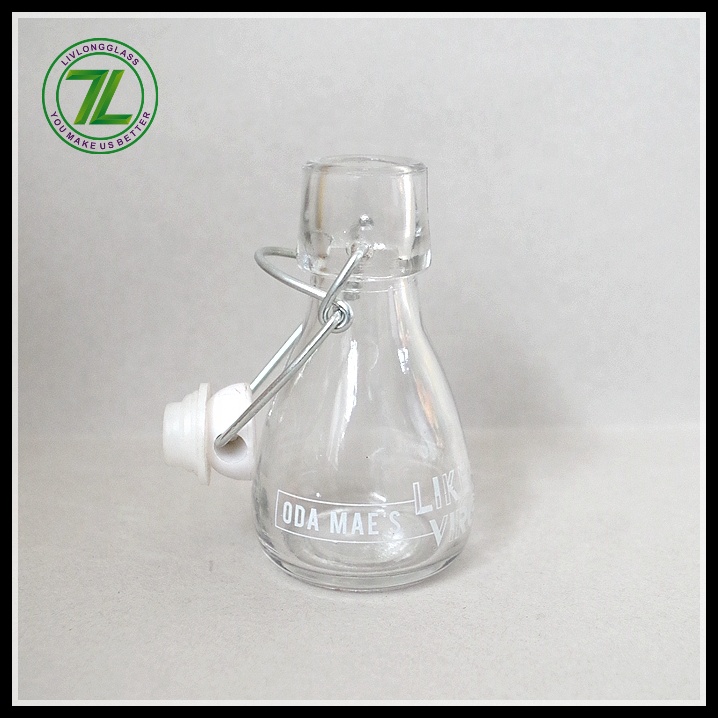 mini small clear round clear beer glass bottle oil sauce cold pressed beverage juice wine use with airtight swing top