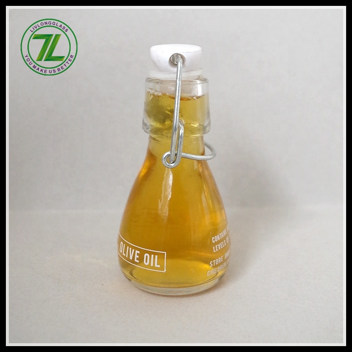 mini small clear round clear beer glass bottle oil sauce cold pressed beverage juice wine use with airtight swing top