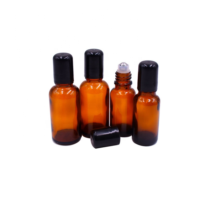 most popular beauty cosmetics empty 1oz amber glass roll on bottle 30ml with stainless steel roller