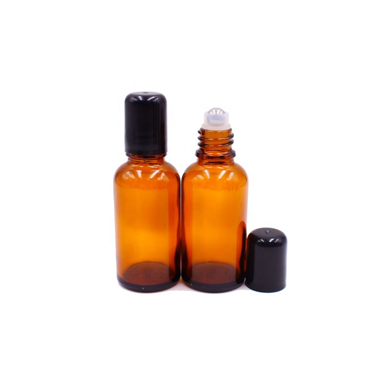 most popular beauty cosmetics empty 1oz amber glass roll on bottle 30ml with stainless steel roller