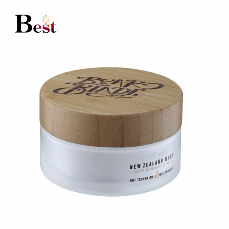 natural bamboo cosmetic packaging logo engraving 50ml bamboo cosmetic jars dark lids glass jars with wood lid