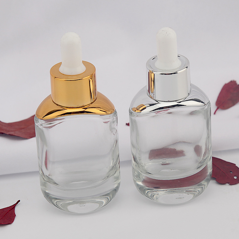 new oval shape 30ml thick bottom clear essential oil glass bottle 1 oz flat cosmetic serum bottles with silver gold dropper