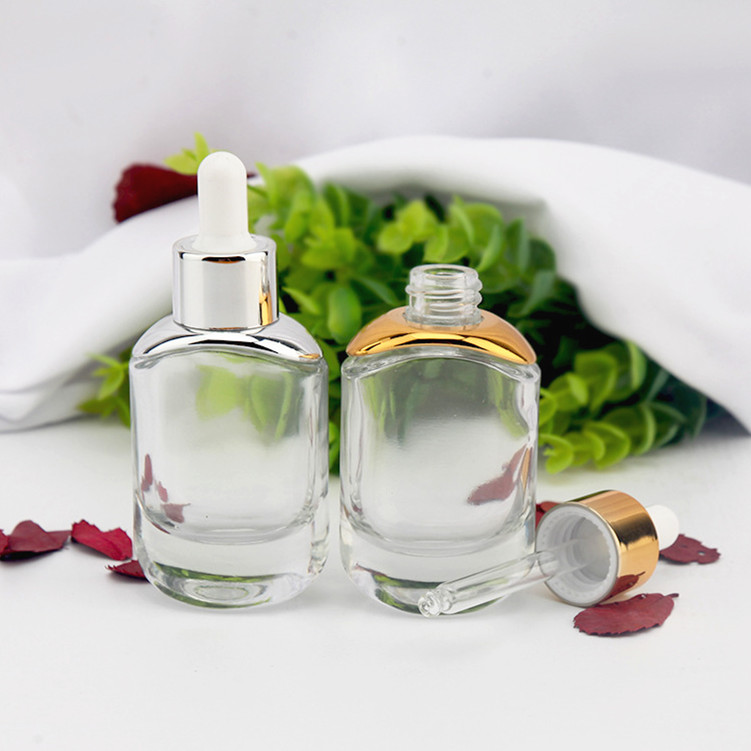 new oval shape 30ml thick bottom clear essential oil glass bottle 1 oz flat cosmetic serum bottles with silver gold dropper