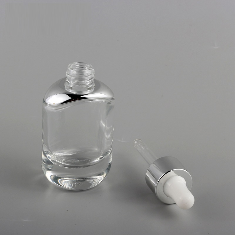 new oval shape 30ml thick bottom clear essential oil glass bottle 1 oz flat cosmetic serum bottles with silver gold dropper