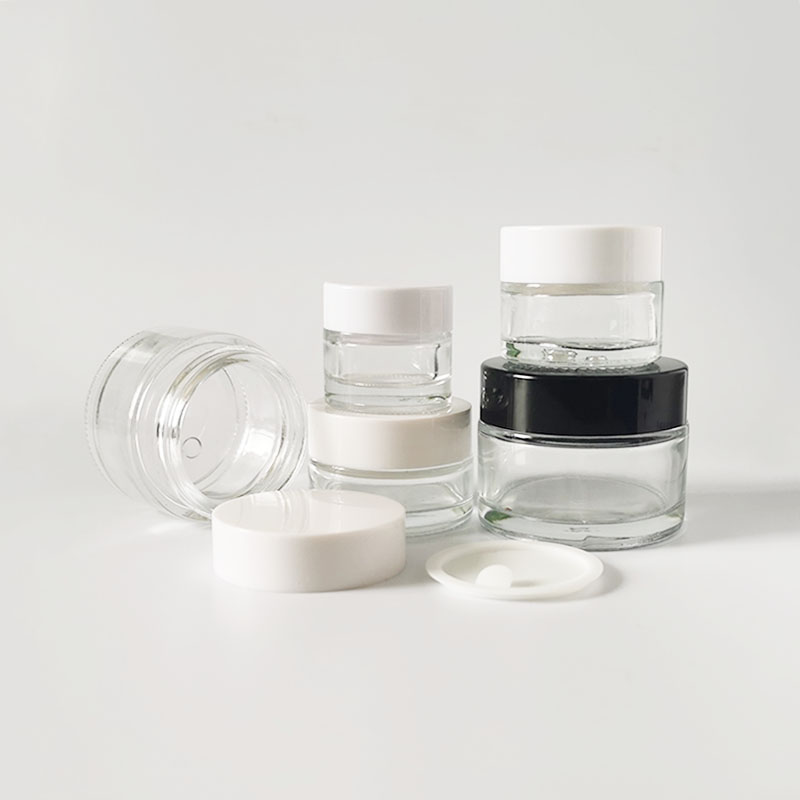packaging for cosmetics clear glass jar black gold silver white lid cap empty containers for lotions and creams