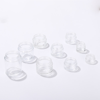 popular shaped moisturiser round glass jar with white screw top lid