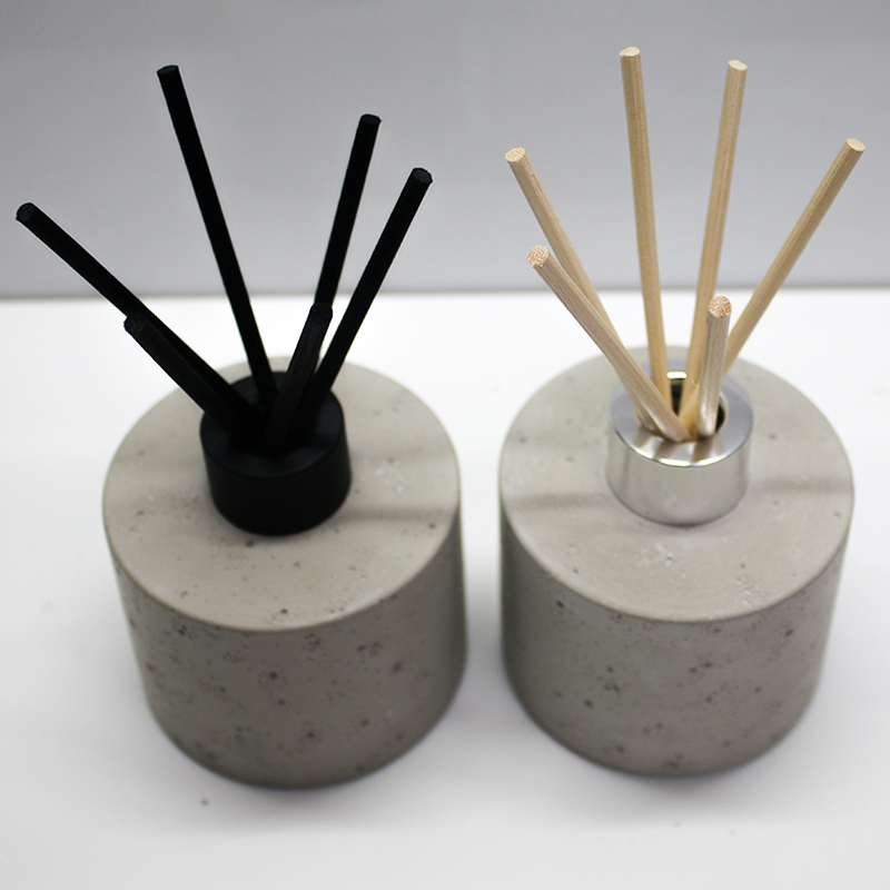 reed diffuser bottle with concrete effect the glass bottle is wrapped with concrete outside bottle and cap