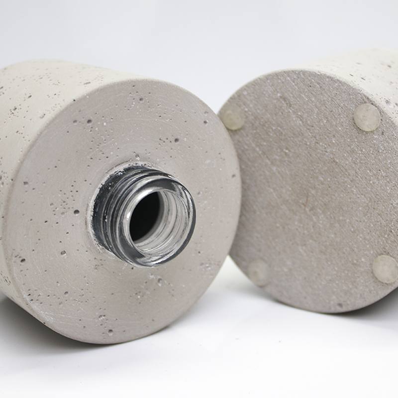 reed diffuser bottle with concrete effect the glass bottle is wrapped with concrete outside bottle and cap