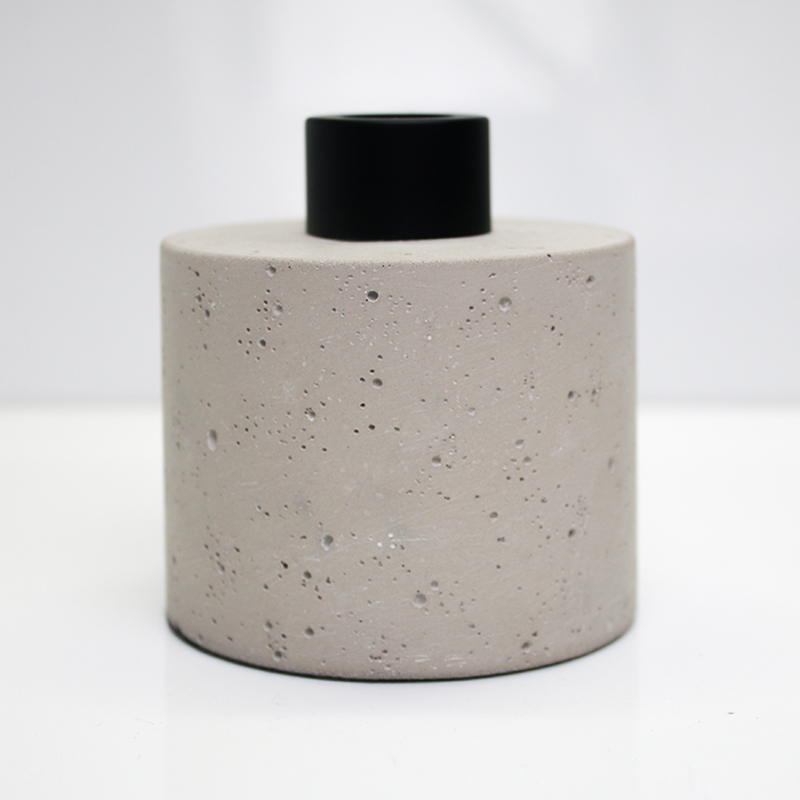 reed diffuser bottle with concrete effect the glass bottle is wrapped with concrete outside bottle and cap