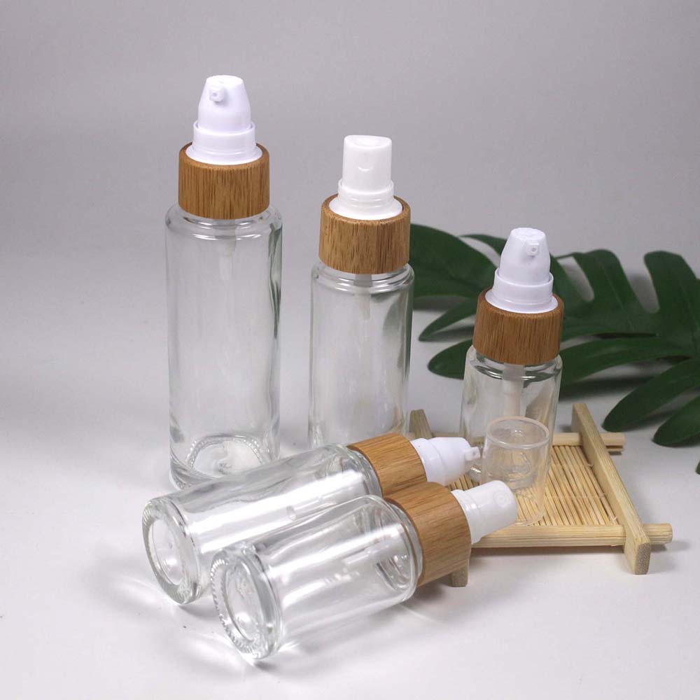 retail and Wholesale 15/20/25/30/50/ML transparency glass lotion/spray pump bottle with bamboo cap skin care container