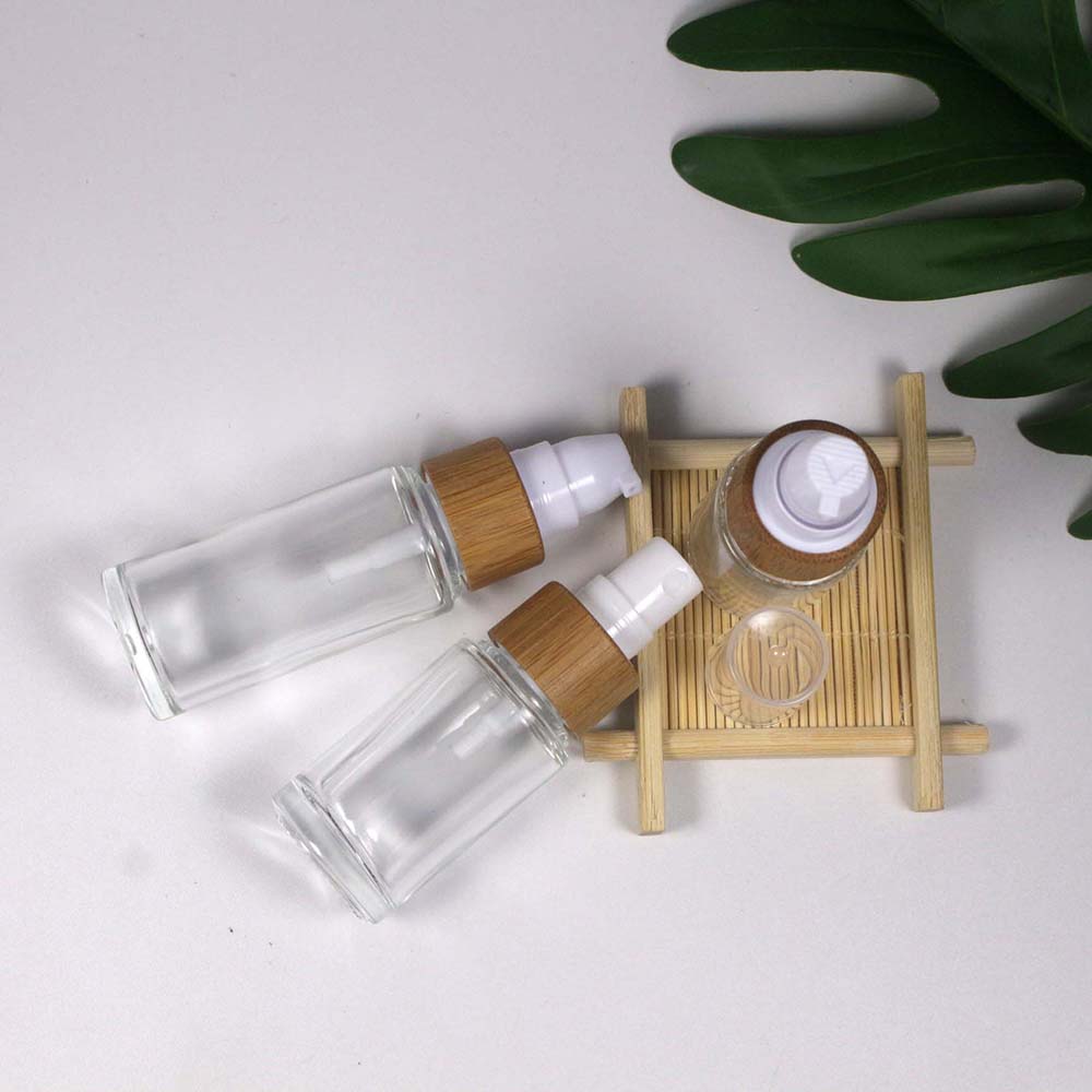 retail and Wholesale 15/20/25/30/50/ML transparency glass lotion/spray pump bottle with bamboo cap skin care container