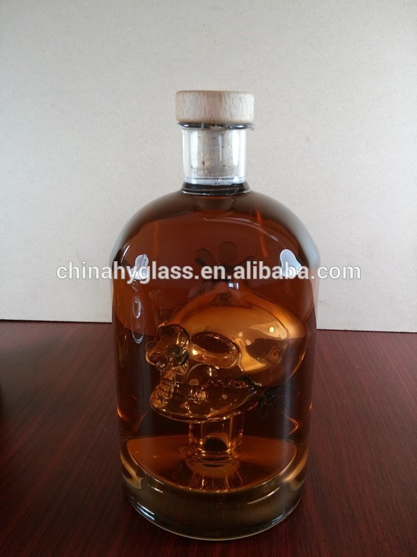 small 750ml whisky bottle with wooden corks