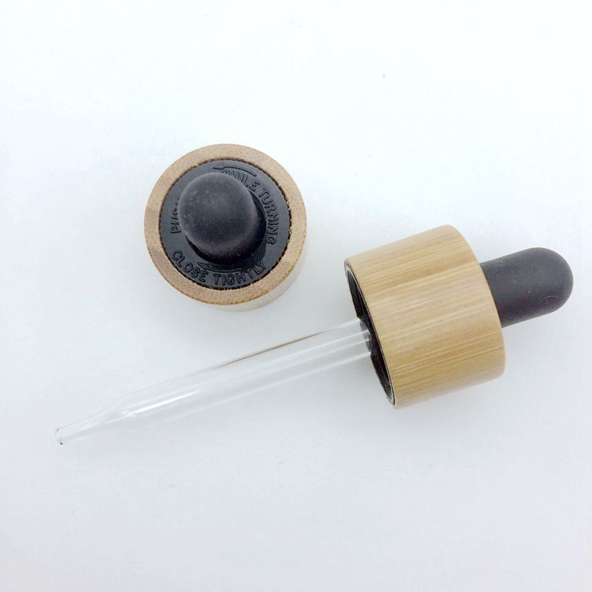 stock and wholesale black silicone rubber crc child-proof bamboo cap bottles essential oil glass 100ml dropper bottle