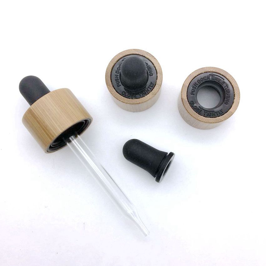 stock and wholesale black silicone rubber crc child-proof bamboo cap bottles essential oil glass 100ml dropper bottle