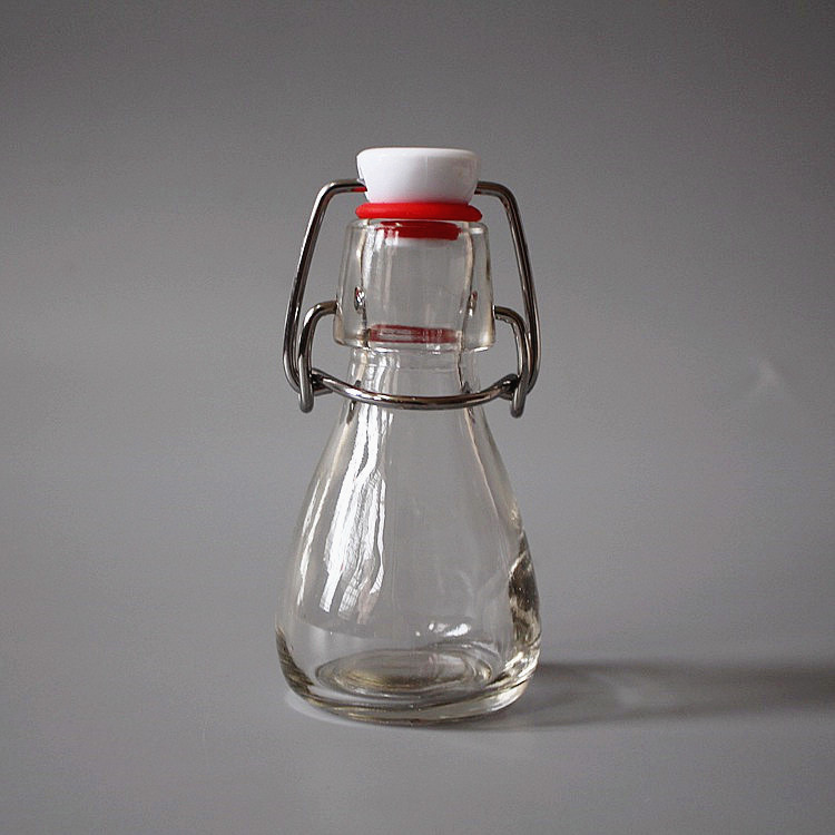 transparent 50ml empty glass bottle for juice with swing top clip lid