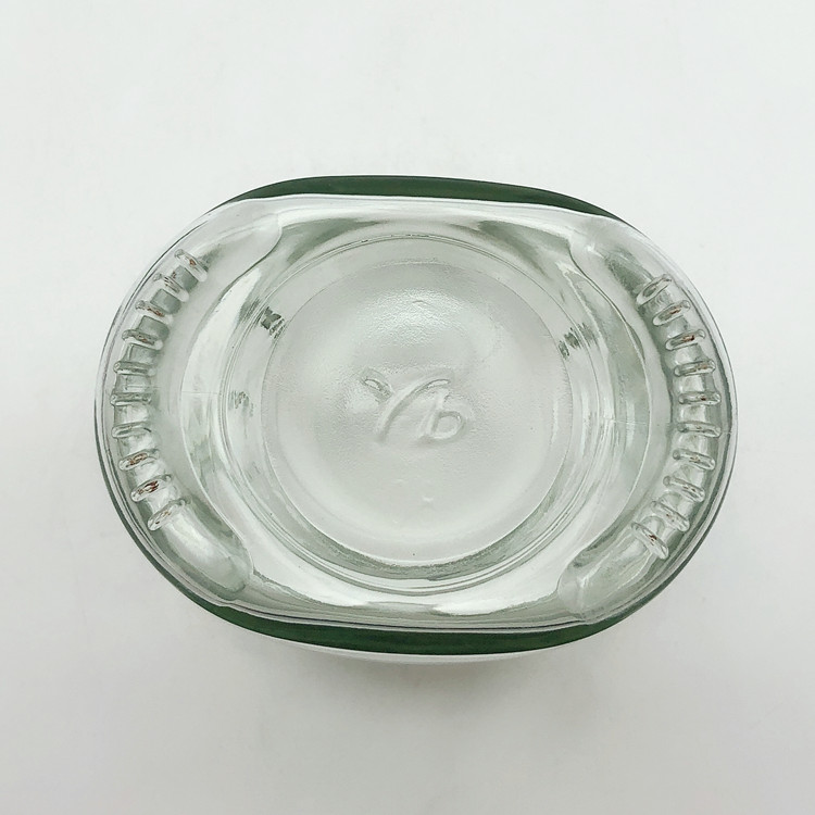 unique shape 200ml clear glass candy jar with metal lug cap