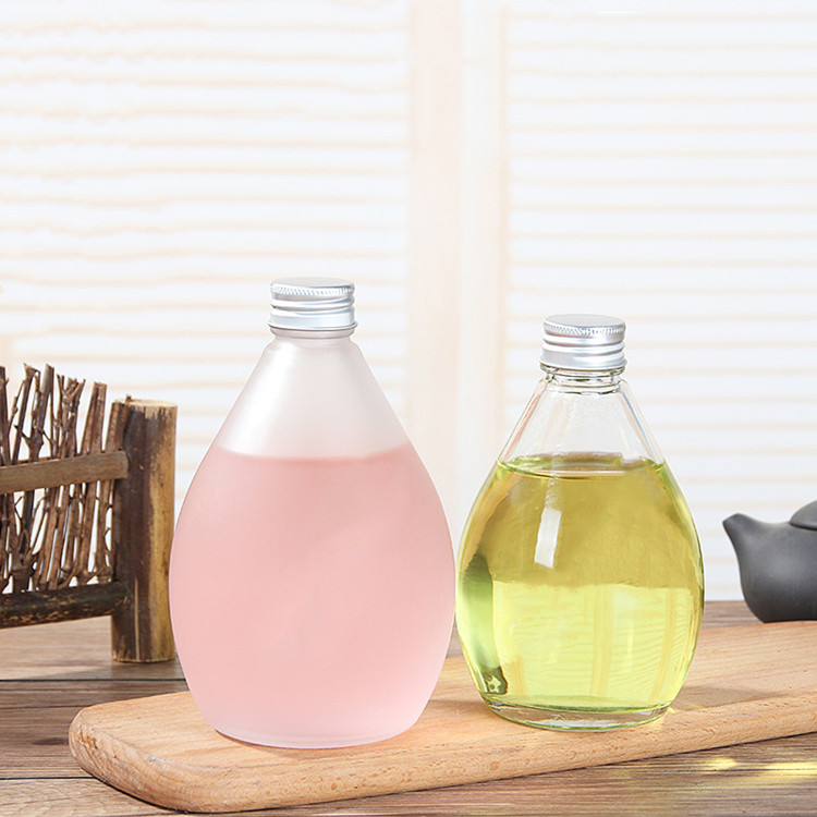 water droplets shape 280ml 350ml 500ml clear or frosted glass beverage bottle with screw cap