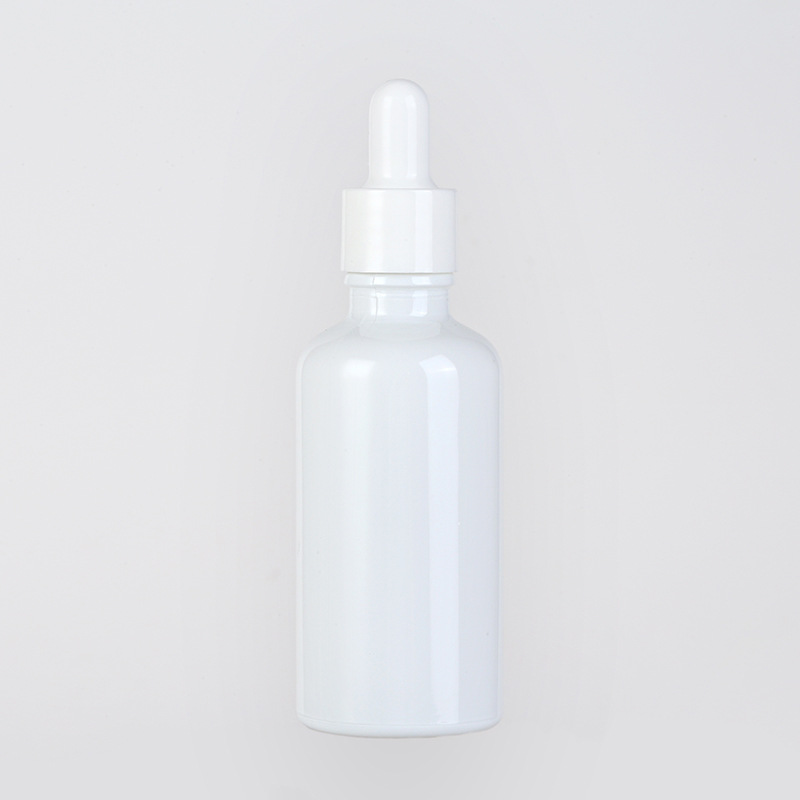 white glass cosmetic dropper bottles and jar White porcelain jar with bamboo wood lid for face cream