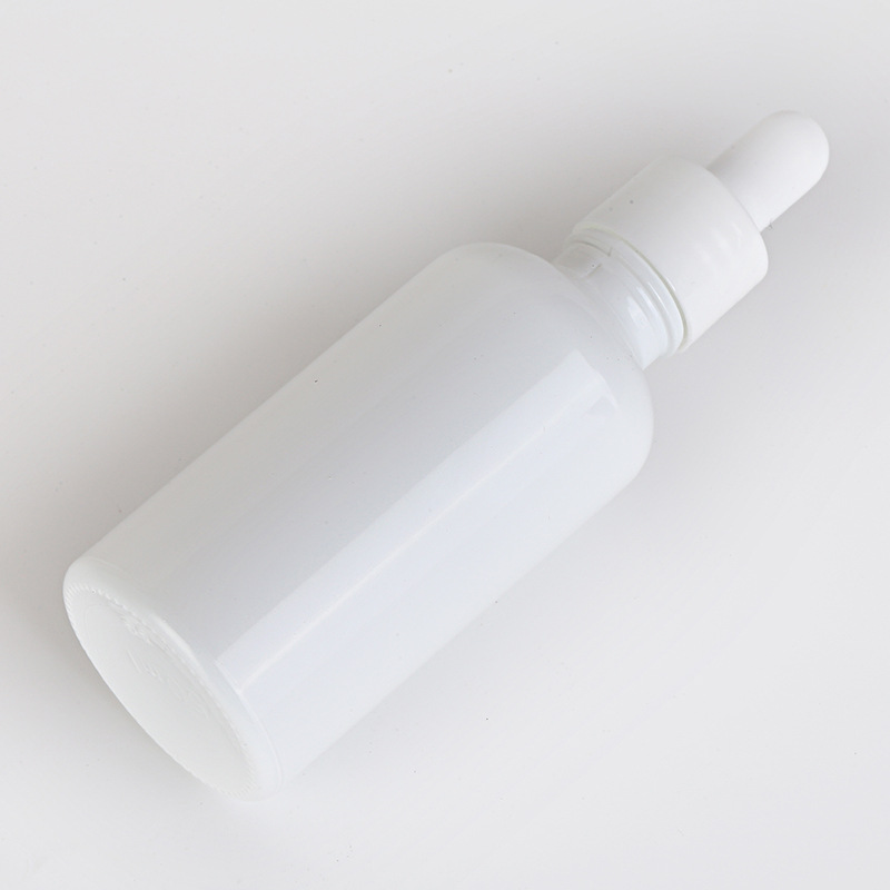 white glass cosmetic dropper bottles and jar White porcelain jar with bamboo wood lid for face cream