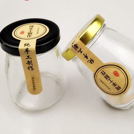 wholesale 100ml 200ml mini glass jam jar with black metal lids round clear glass storage pudding bottle for honey in bulk