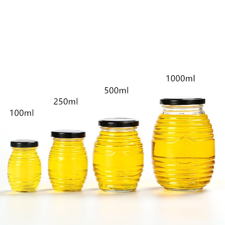 wholesale 100ml200ml350ml730ml clear empty glass bee shaped custom honey packaging jar container