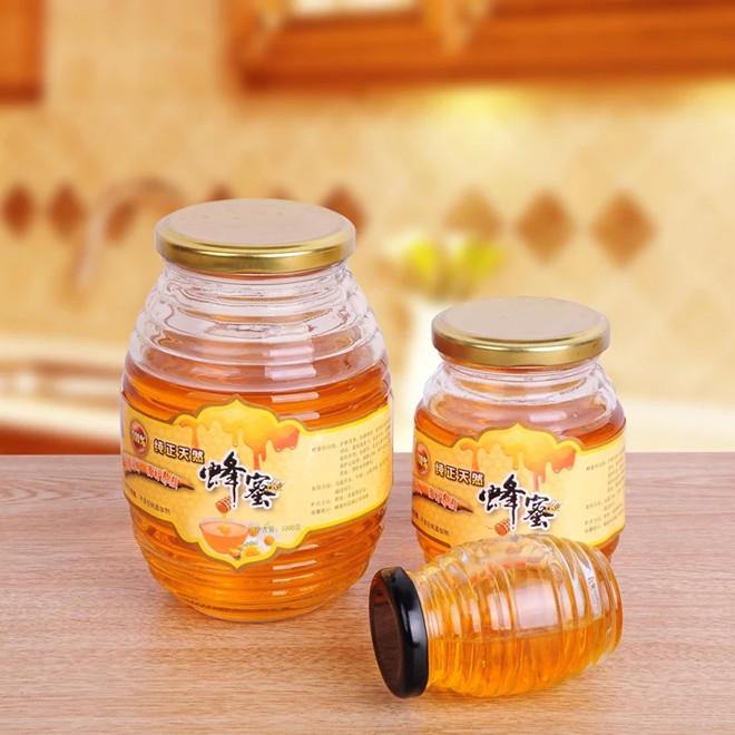 wholesale 100ml200ml350ml730ml clear empty glass bee shaped custom honey packaging jar container