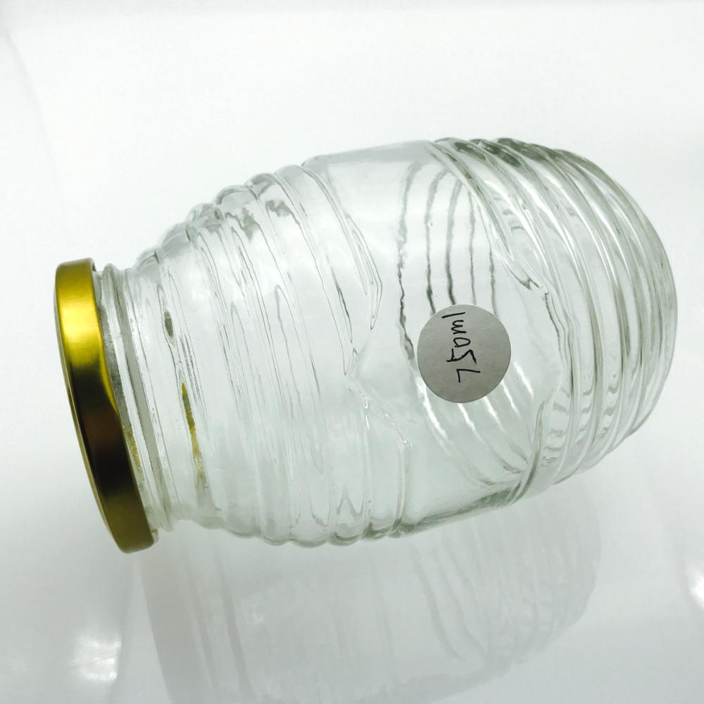 wholesale 100ml200ml350ml730ml clear empty glass bee shaped custom honey packaging jar container