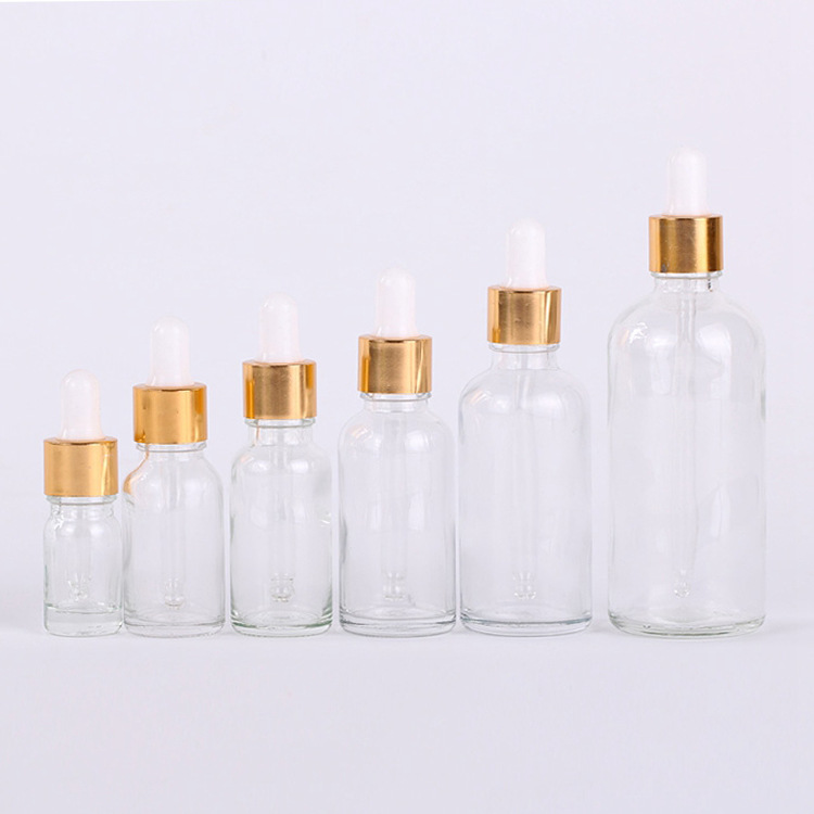 wholesale 10ml glass clear, amber 30ml 50ml cosmetic packaging essential oil gold glass bamboo dropper bottle/