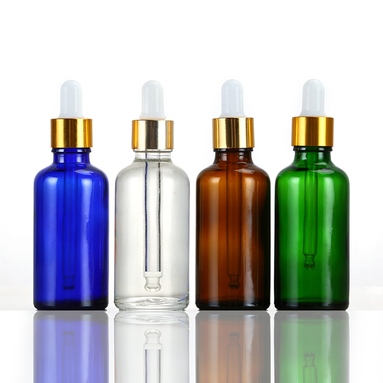 wholesale 10ml glass clear, amber 30ml 50ml cosmetic packaging essential oil gold glass bamboo dropper bottle/