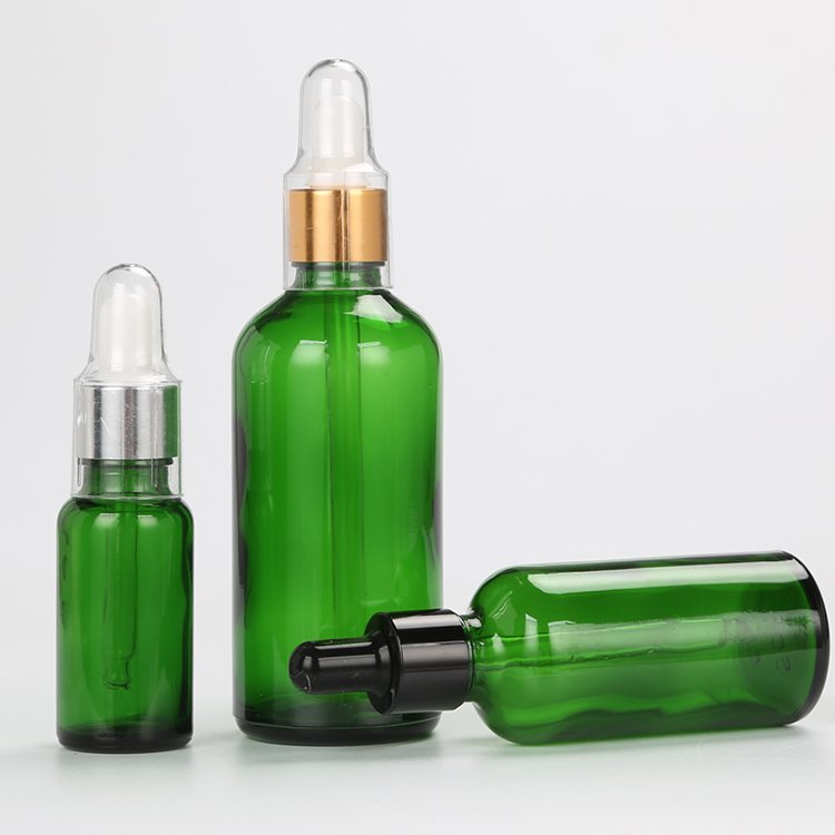wholesale 10ml glass clear, amber 30ml 50ml cosmetic packaging essential oil gold glass bamboo dropper bottle/