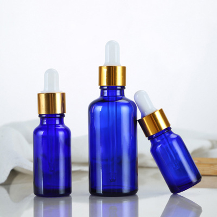 wholesale 10ml glass clear, amber 30ml 50ml cosmetic packaging essential oil gold glass bamboo dropper bottle/