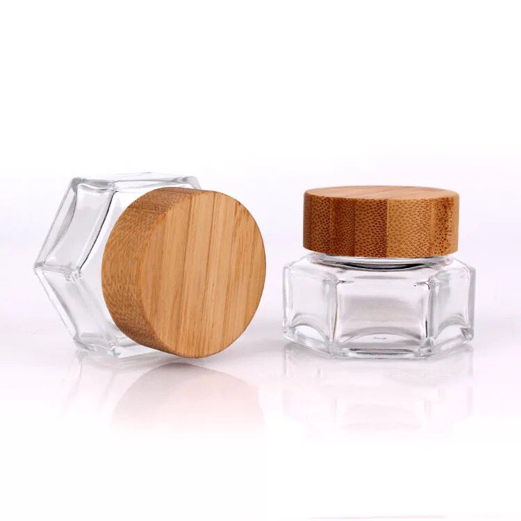 wholesale 1oz 2.5oz 3oz 30ml 50ml hexagonal cosmetic skin care glass jar for face cream lotion with bamboo wooded lid