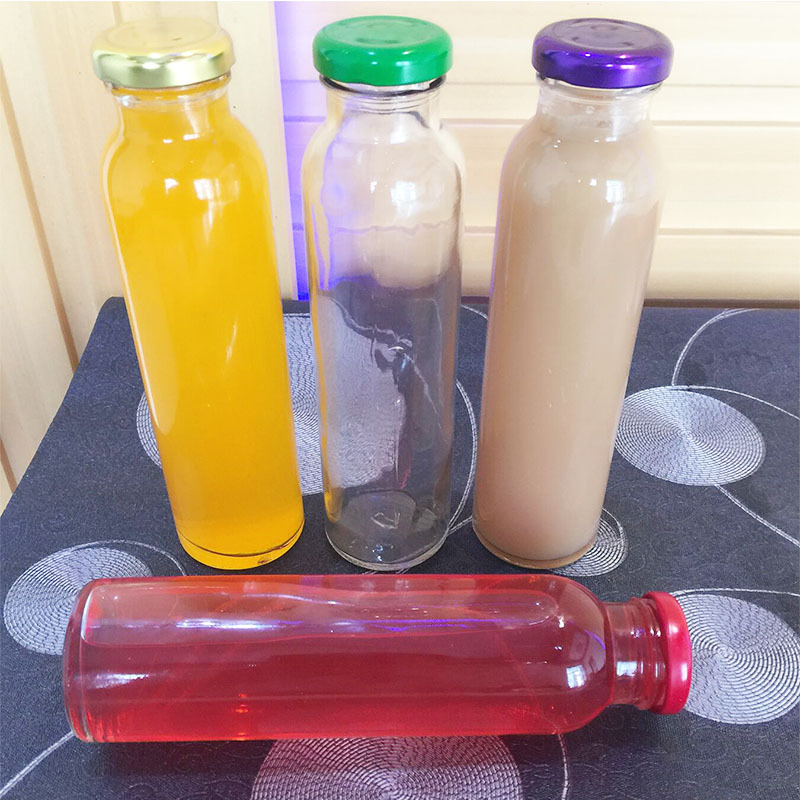 wholesale 300ml clear empty round glass beverage/juice/drinking bottle with screw cap